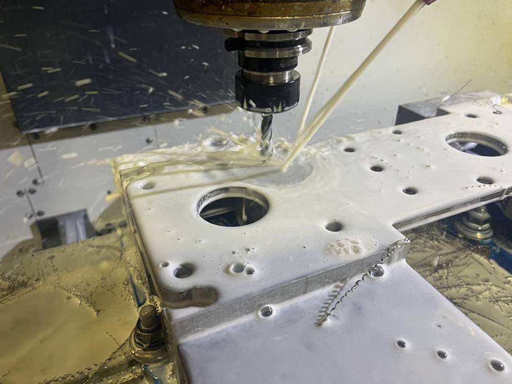 CNC mill machining an aluminum plate
