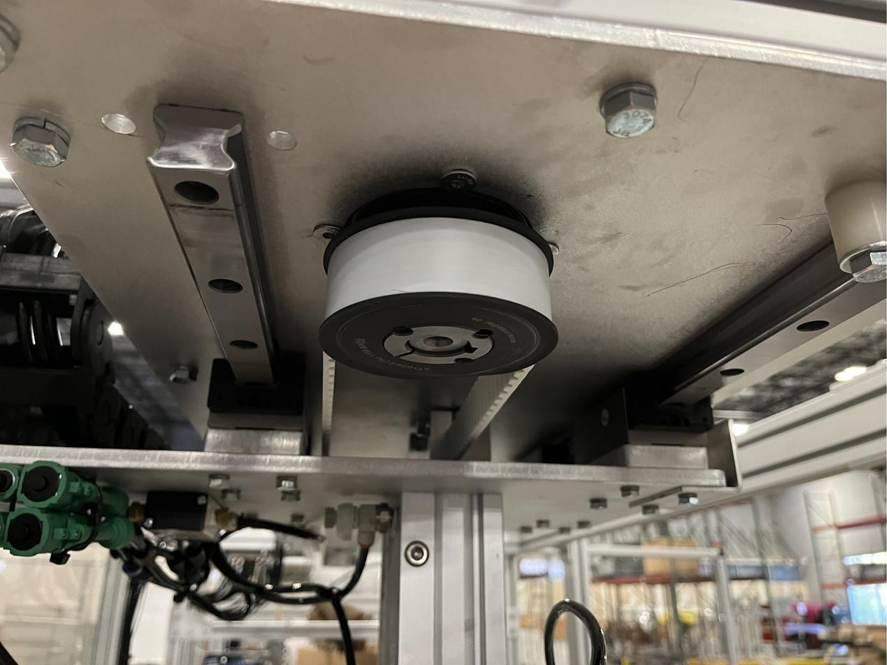 Linear rails and belt drive pulley under a carriage