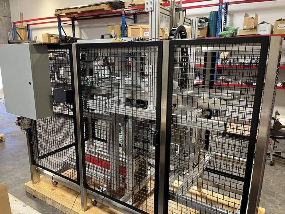Guarded custom automation cell on a shipping skid