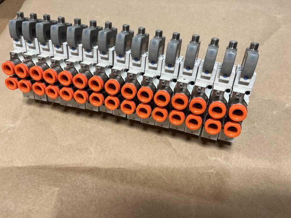 Row of pneumatic valves on a manifold