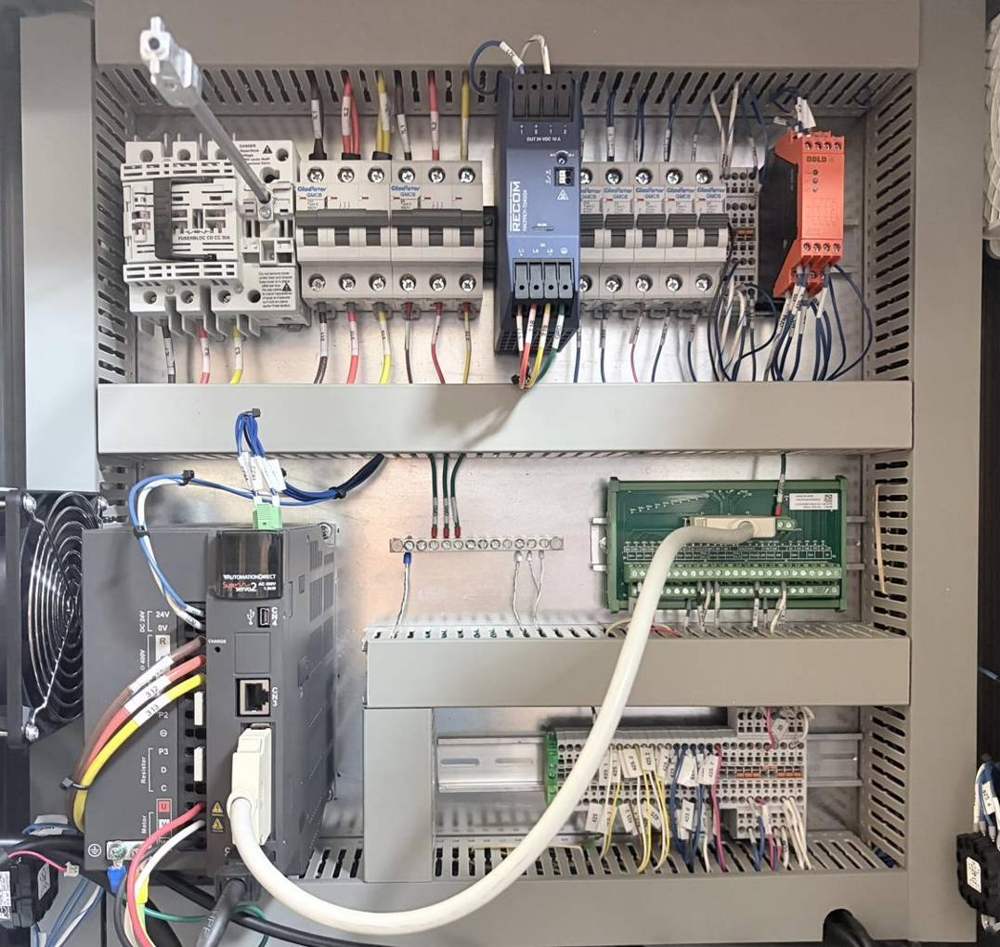 Control panel with servo drive, power supply and labeled terminals