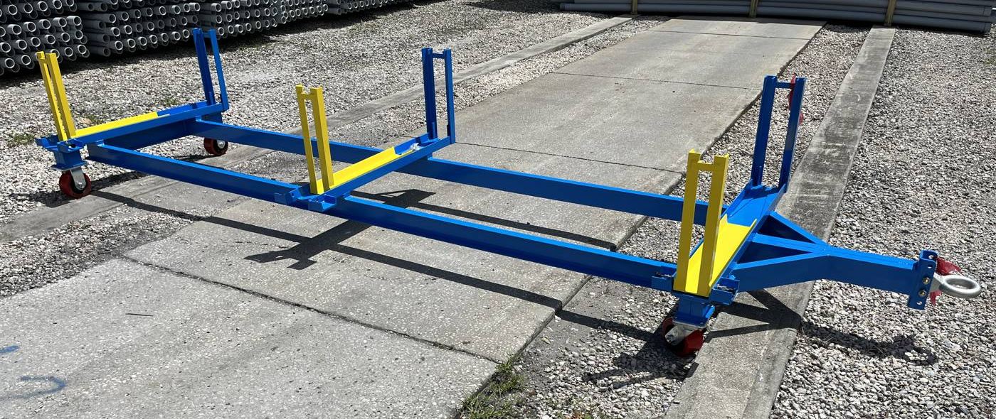 Blue and yellow steel pipe cart with tow hitch and casters
