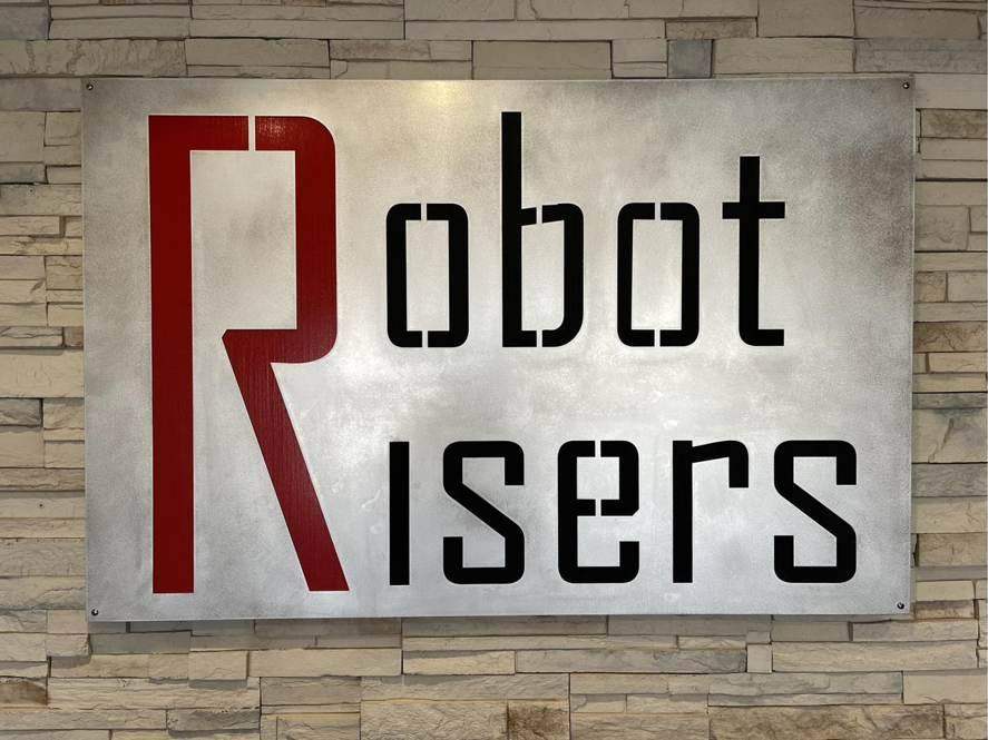 Robot Risers sign in the shop lobby