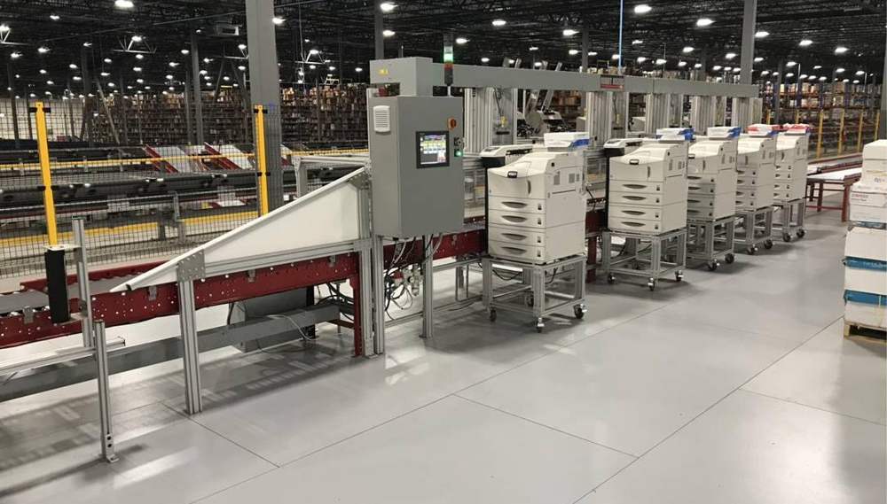 Print stations alongside a conveyor line