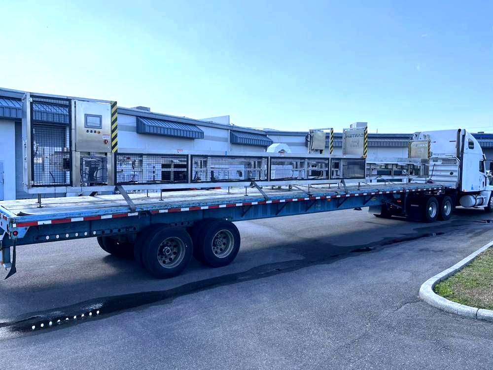 Sorter sections loaded on a flatbed trailer