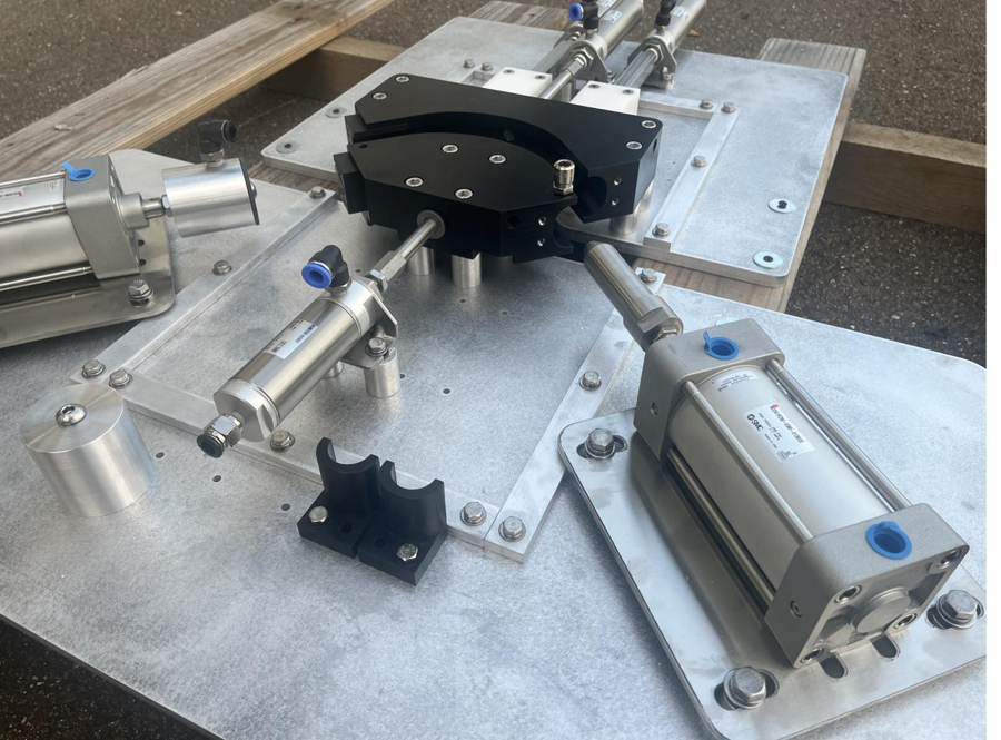 Rotary fixture with pneumatic cylinders