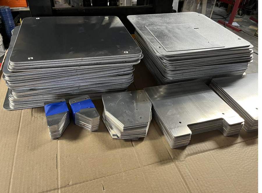 Stacks of machined aluminum plates