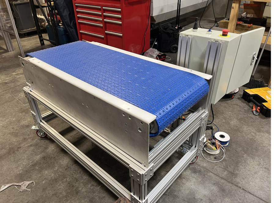 Blue belt transfer table on a caster frame